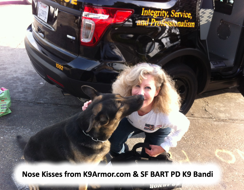 BART PD K9 Bandi giving kisses to K9 Armor cofounder Suzanne Saunders, photo by Officer Edwards
