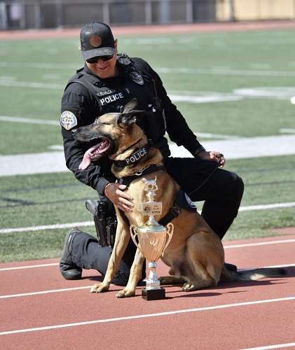 Donate to protect Maxo. Hugs from Gardena PD Officer Ruvalcaba and Maxo winner of best Call-Off at the LACPCA Trials 2024