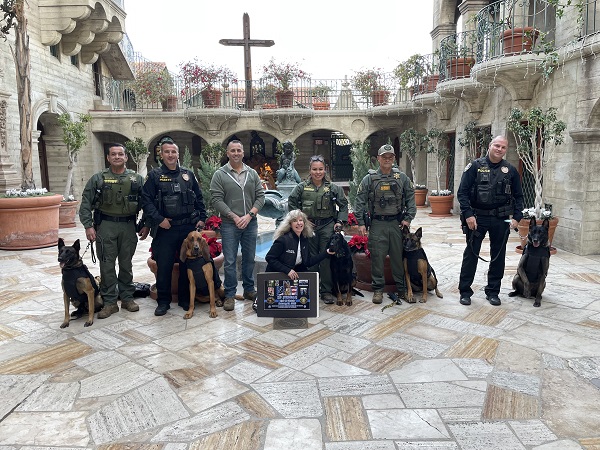 Smiles from RSO K9 Sniper, Deputy Naccarato, Riverside PD Ofc Miller, K9 Ruger, K9 Armor cofounders RSO Corporal Hurd and Suzanne Saunders, RSO Deputy Sandoval, K9 Raven, Deputy Casillas, K9 Sky, Riverside PD Ofc Cleary, K9 Vigo