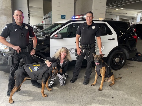 Smiles from  Santa Ana PD Officer Guidry and Rosie, K9 Armor cofounder Suzanne, Officer Shifflet and Kuno