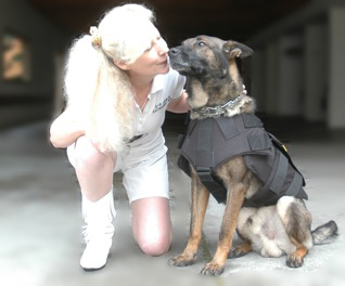 St Helena PD K9 Djino gives K9 Armor Cofounder Suzanne Saunders a kiss for his new bulletproof vest